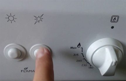 Бутон на системата за запалване на газовата печка
